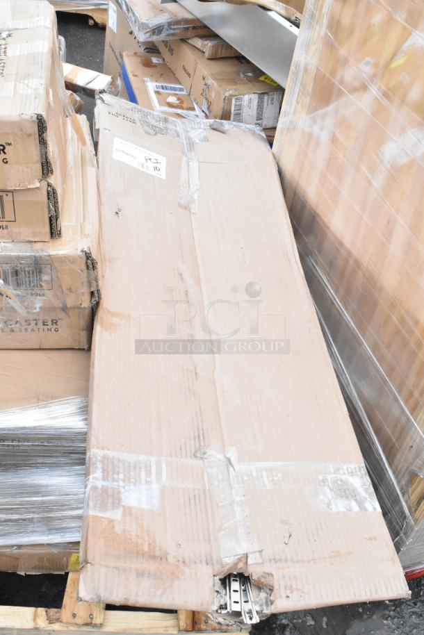 Cardboard boxes with scratch and dent auction items, including wire shelves and sink. Visible wear on packaging.