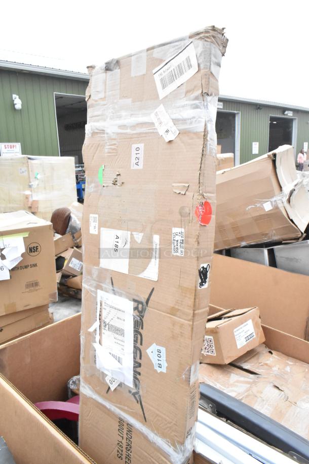 Damaged boxes of various new items including Regency cart, gloves, ingredient bin. Visible scratches and dents. Labels intact.