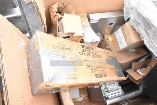 Boxes of Lancaster Table & Seating items with visible dents. Includes splash guard, flight paddle, ingredient bin.
