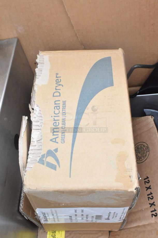 Cardboard box labeled "American Dryer Green Clean Extreme" with visible wear and shipping label.