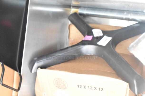 15 new scratch-and-dent items, including splash guard and paddle, on a 12x12x12 box. Tags visible.