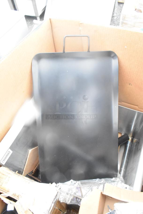 Box containing 15 brand new scratch and dent items, including black splash guard, flight paddle, and ingredient bin.