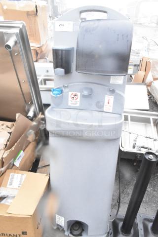 Brand new portable hand wash sink, scratch and dent condition. Features soap dispenser, water fill sign, and instructions.