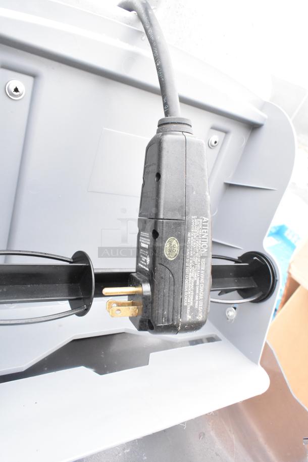 Brand new portable hand wash sink, plug and cable visible, slight scratches and dents, ready for setup.