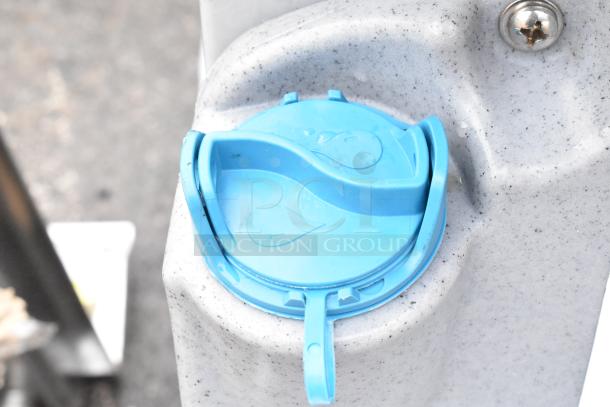 Brand new scratch and dent portable hand wash sink, featuring a blue water tap on speckled grey material.