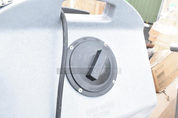 Brand new portable hand wash sink, scratch and dent condition, gray water access label, vent and lock features visible.