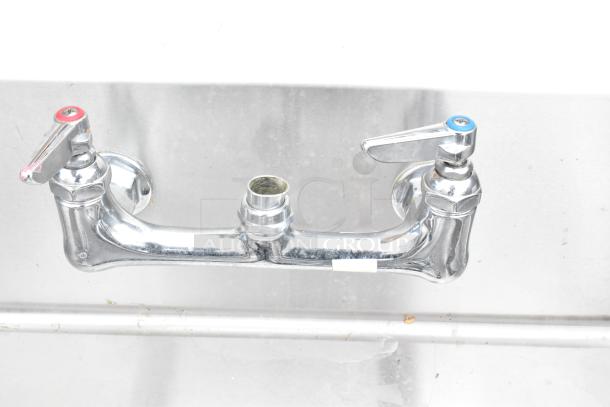 Brand new left side dirty dish table, no legs, scratch and dent condition, features dual-handle faucet.