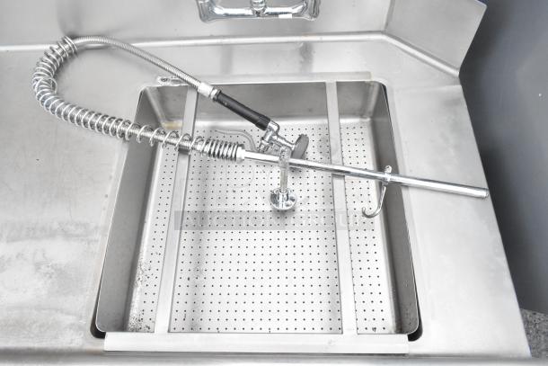 Brand new scratch and dent left side dirty dish table, no legs, visible spray nozzle, stainless steel, NSF label.