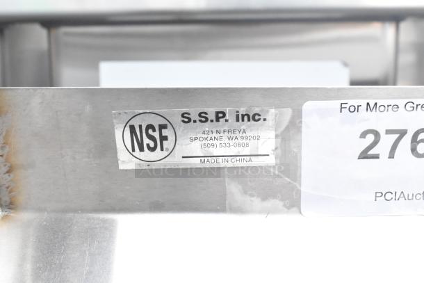Brand new wall shelf with scratches and dents. Stainless steel. NSF certified. Made by S.S.P. Inc., Spokane, WA.