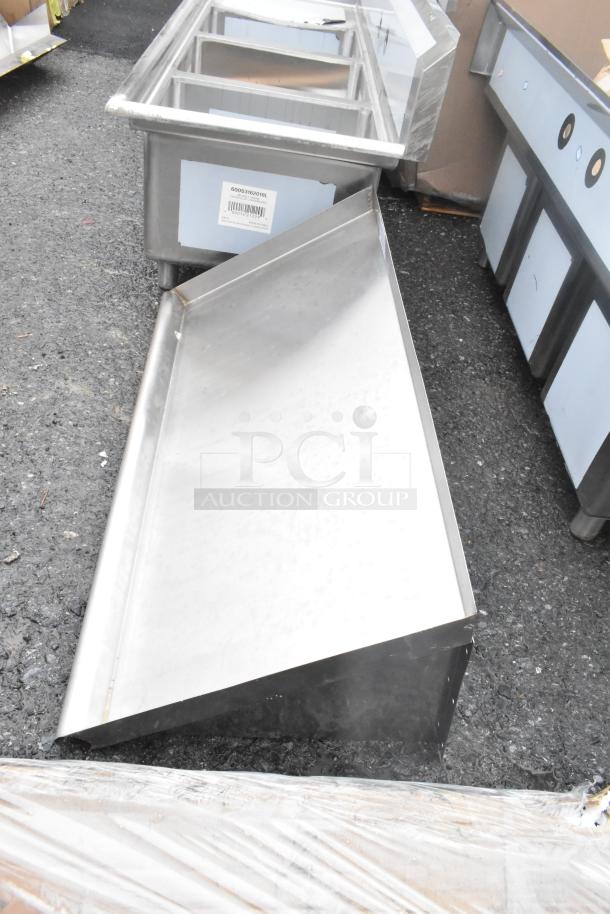 Brand new scratch and dent wall shelf, stainless steel, minor imperfections, visible label with barcode.