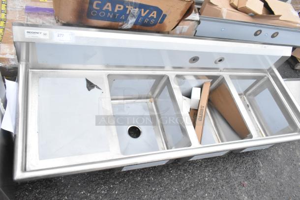 BRAND NEW Regency 600S3162018L stainless steel 3-bay sink with left side drain board, visible scratches and dents.