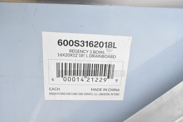 Alt text: Regency 600S3162018L stainless steel 3 bay sink with left side drain board. Brand new, scratch and dent condition. Label shows dimensions 16x20x12, made in China.