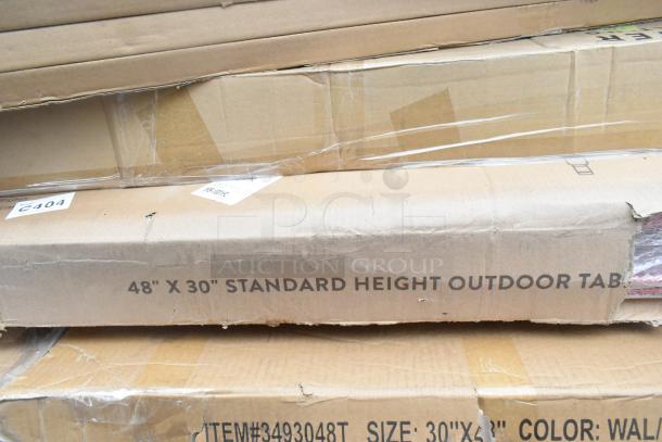 15 brand new scratch and dent items in boxes, including a 48"x30" outdoor table, shelving posts, and a sink.