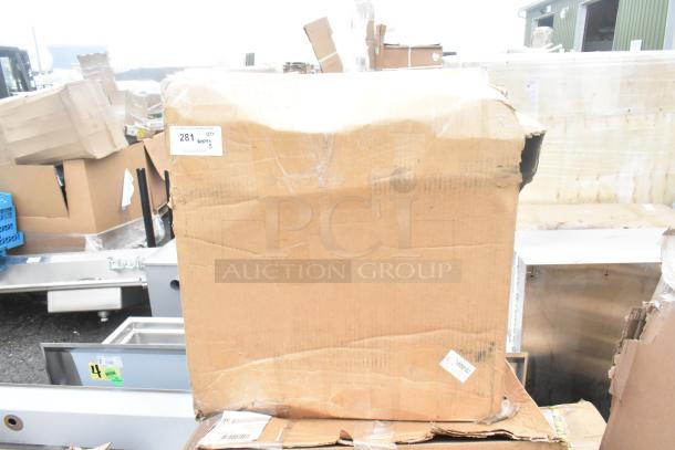 A large cardboard box labeled "Qty 5" containing brand new scratch and dent sinks, slightly damaged exterior.