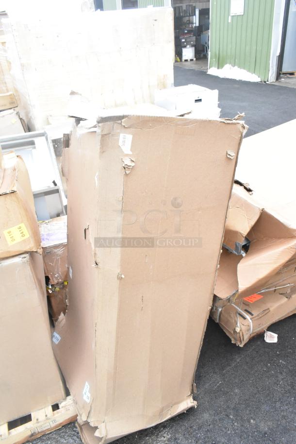 Damaged cardboard boxes containing five brand new scratch and dent items, including sinks. Boxes show wear and labeling.