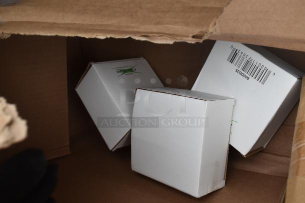 Boxes labeled "Regency" inside packaging, part of a brand new Regency 600S31416212 3 Bay Sink. Scratch and dent condition.