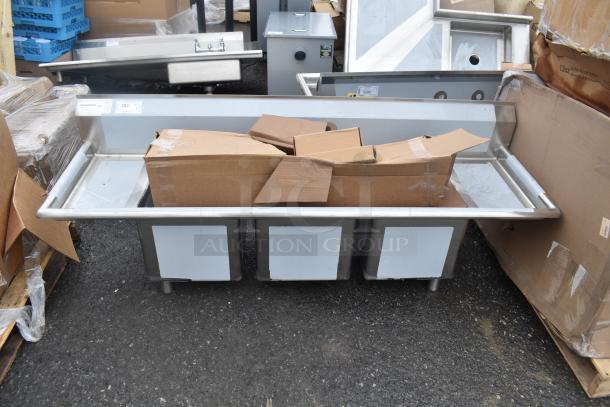 Brand new Regency 600S31416212 3 bay sink, scratch and dent condition, with protective cardboard covering.