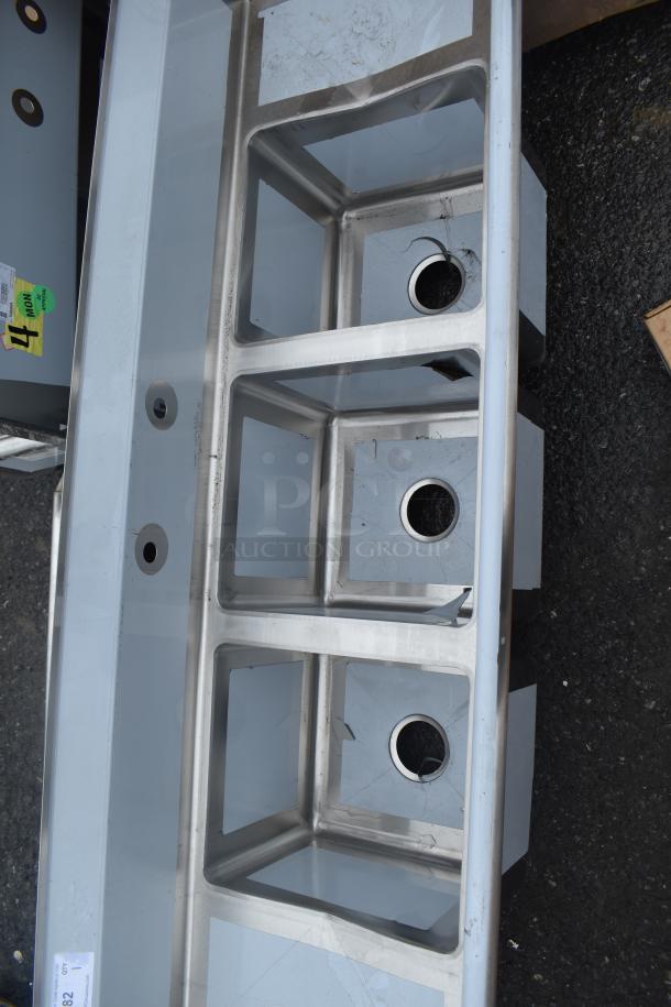 Brand new Regency 600S31416212 3 bay sink, stainless steel, scratch and dent. Labels indicate inspection details.