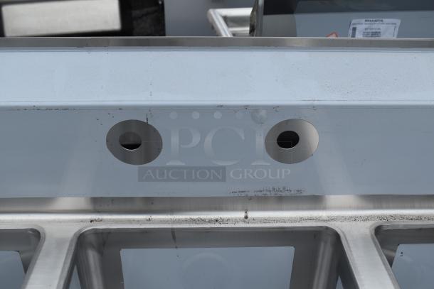 Brand new Regency 600S31416212 3 bay sink with light surface scratches. Silver finish, includes drain openings and leg supports.