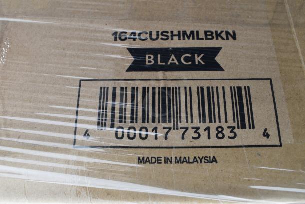 Label on cardboard box showing "164CUSHMLBKN," "BLACK," barcode, and "Made in Malaysia," indicating new cushions.