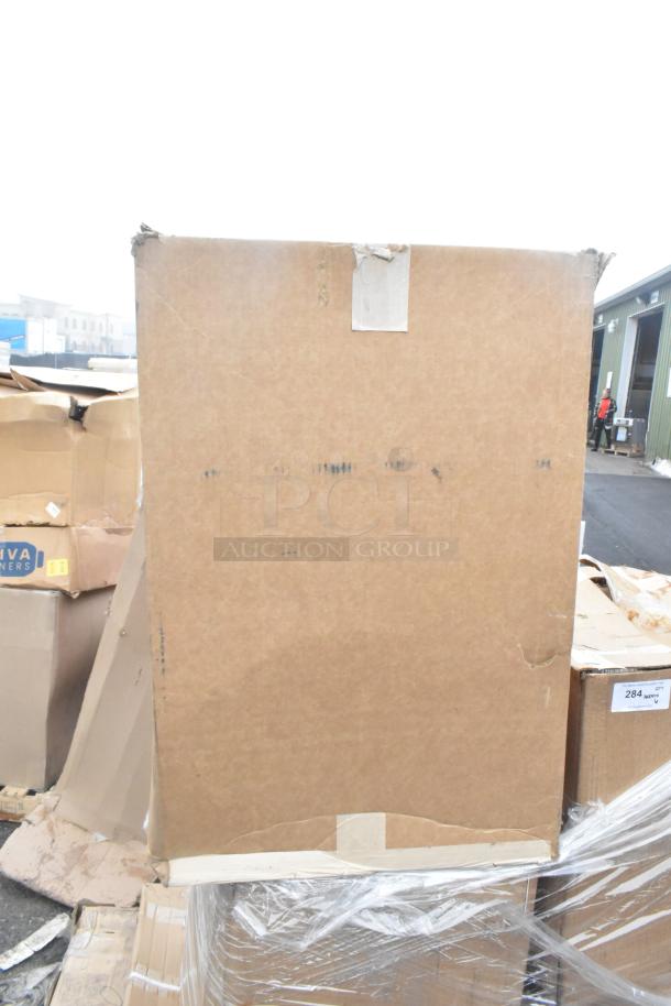 Box of 6 new scratch and dent items including pie pans, work table. Visible wear on packaging. Auction lot with label "284".