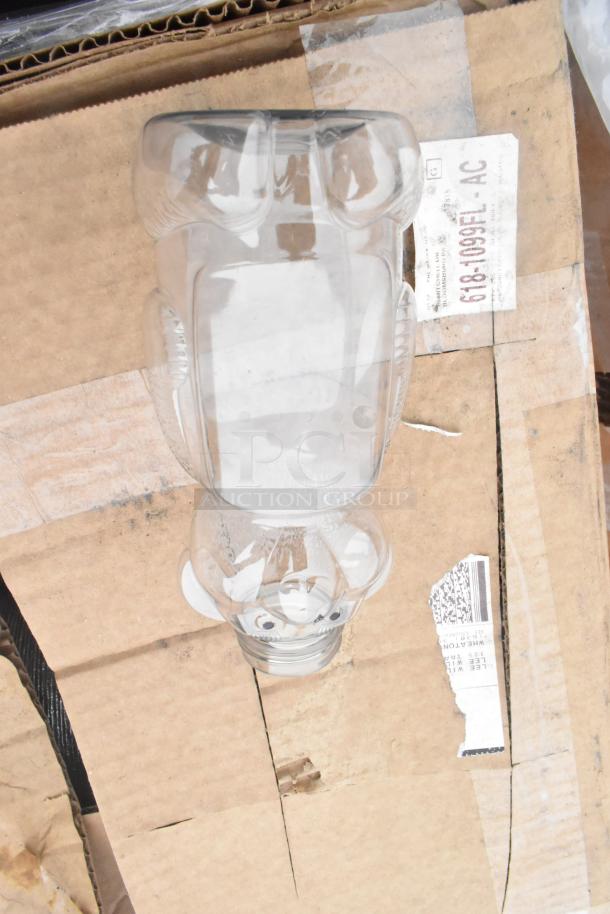 Glass jar with unique shape on cardboard packaging. Marking shows "618-1093 FEL-AC." Condition appears new but dusty.