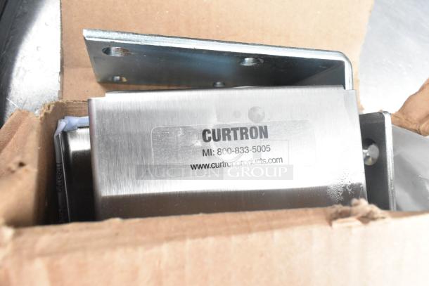 Stainless steel swinging door hardware in box, featuring Curtron branding and contact details, new condition.