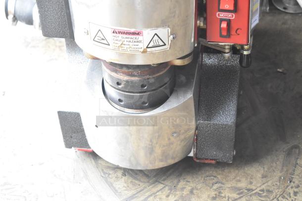 Magic Pop DMP-1 Metal Commercial Rice Cake Machine, 115V, 1 Phase. Features warning labels and motor switch.