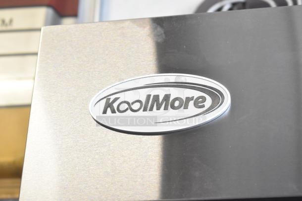 "Brand new KoolMore RIF-3D-SS commercial freezer, 72 cu ft, 115 volts, 1 phase, scratch and dent condition, logo visible."