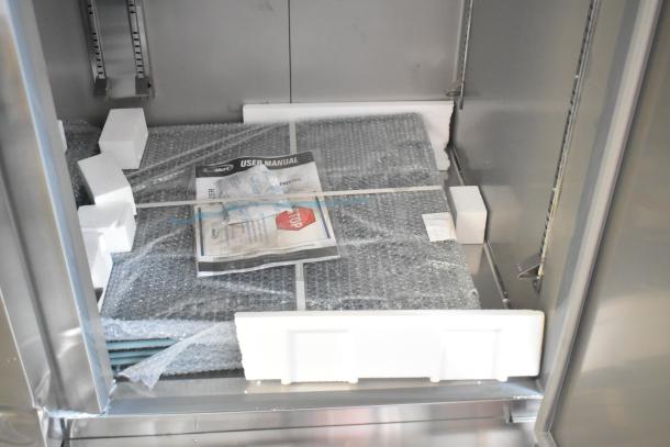 Brand new KoolMore RIF-3D-SS commercial 3 door freezer. Scratch and dent model; packaging materials and manual visible inside.