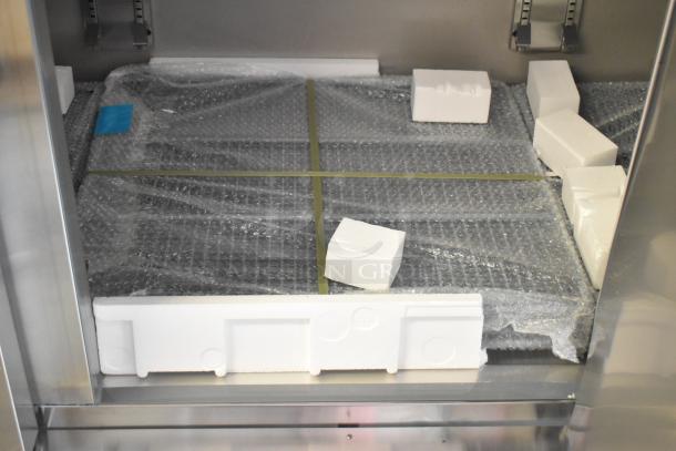 BRAND NEW KoolMore RIF-3D-SS 3 Door Reach-In Freezer; interior with protective wrapping and foam for shipping.