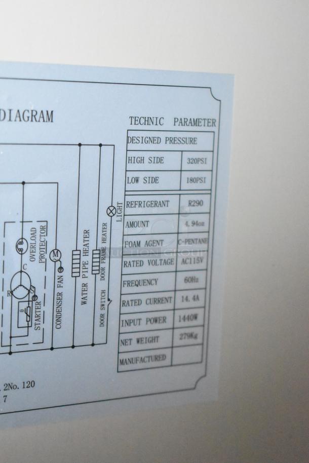 Label on KoolMore RIF-3D-SS Commercial 3-Door Freezer showing technical parameters, refrigerant type, and voltage.