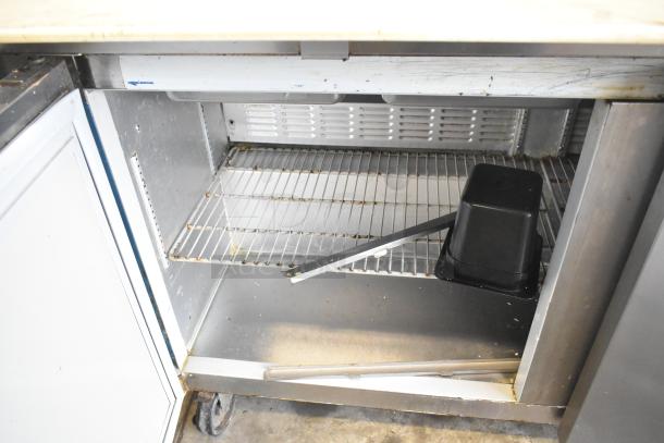 Hoshizaki CRMR60-24M prep table; commercial, bain marie top, 115V, 1 phase; inside condition shows age and use.