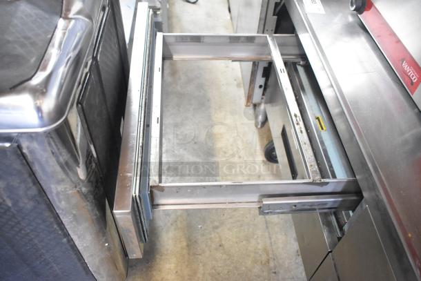 Delfield Commercial 4 Drawer Chef Base with open drawer, on casters, 115V, 1 Phase. Stainless steel, used condition.