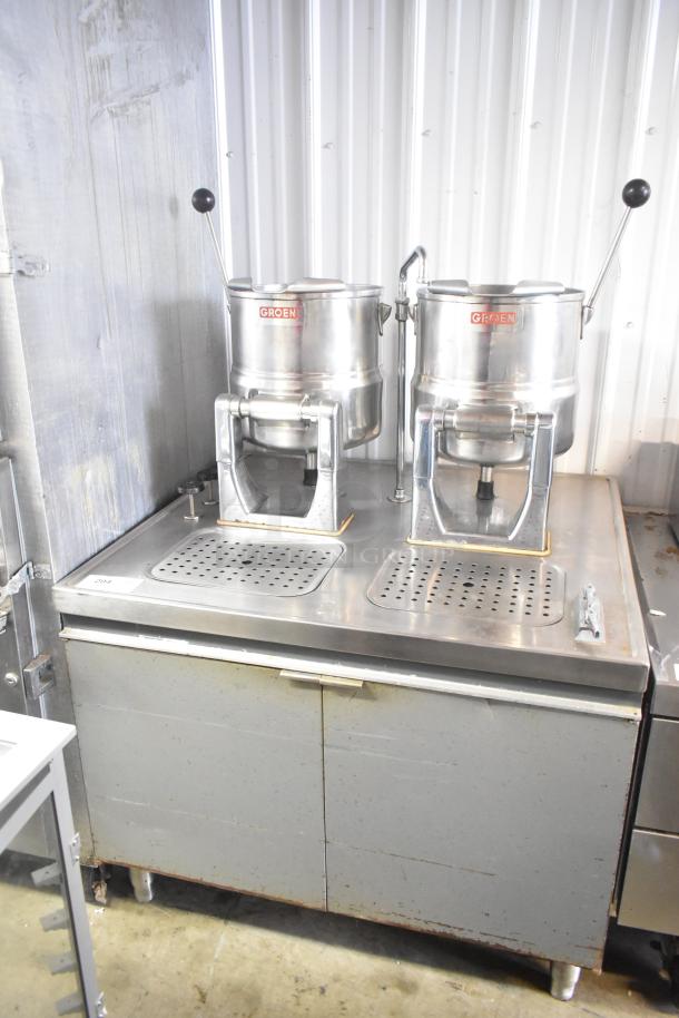 2 Groen tilting kettles on Market Forge MT2-5ES modular base, stainless steel, used condition, visible Groen logo.