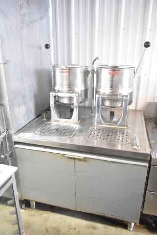 2 Groen tilting kettles on Market Forge MT2-5ES modular base, stainless steel, used condition, visible Groen logo.