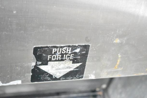 Cornelius ED150 ice dispenser, stainless steel, "Push for Ice" label visible. Commercial use, 115V, good condition.