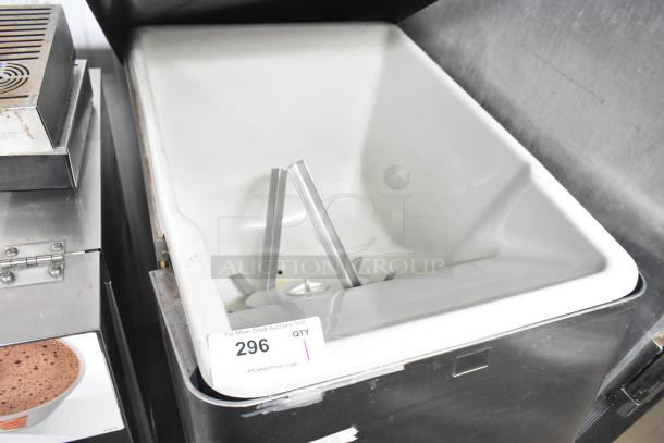 Cornelius ED150 Commercial Ice Dispenser, countertop model. 115 volts, 1 phase. Stainless steel with white interior, minor wear. Auction tag reads "296 QTY 1".