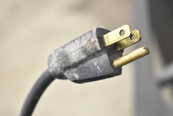 Close-up of a power plug for the Cornelius ED150 Ice Dispenser, 115 Volts, 1 Phase. Plug shows signs of wear.