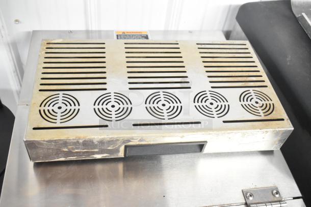 Bunn IMIX-5 stainless steel cappuccino machine, visible wear, on stand. 120/208-240V, 1 phase. Top view with vents.