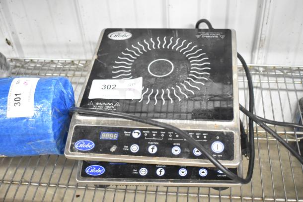 2 Globe IR1800 induction burners, 2022 model, countertop, electric, 120V, 1 phase. Visible controls and warning labels.