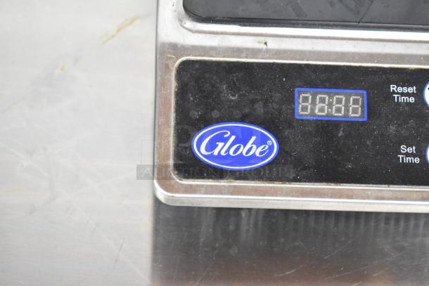 Globe IR1800 induction range control panel close-up, showing the brand logo and digital timer display.