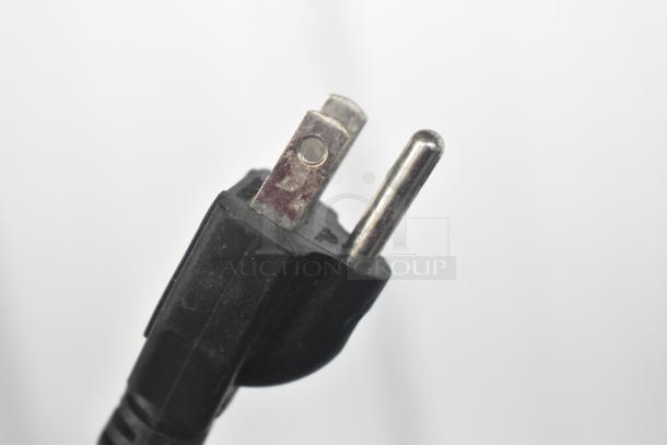 Close-up of an electrical plug from a 2022 Globe IR1800 induction range, 120 volts, 1 phase.