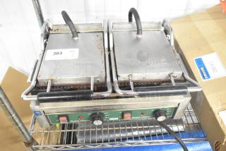 Waring WPG300 countertop double panini press, used condition, 240 volts, 1 phase. Features adjustable temperature controls.
