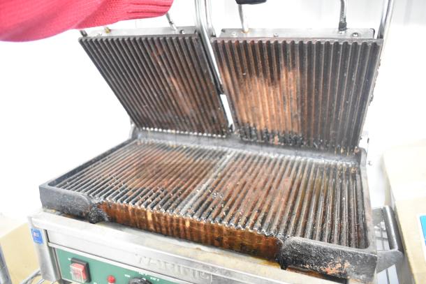 Waring WPG300 Countertop Double Panini Press, used condition, visible wear on grill plates, 240V, 1 Phase, model label intact.