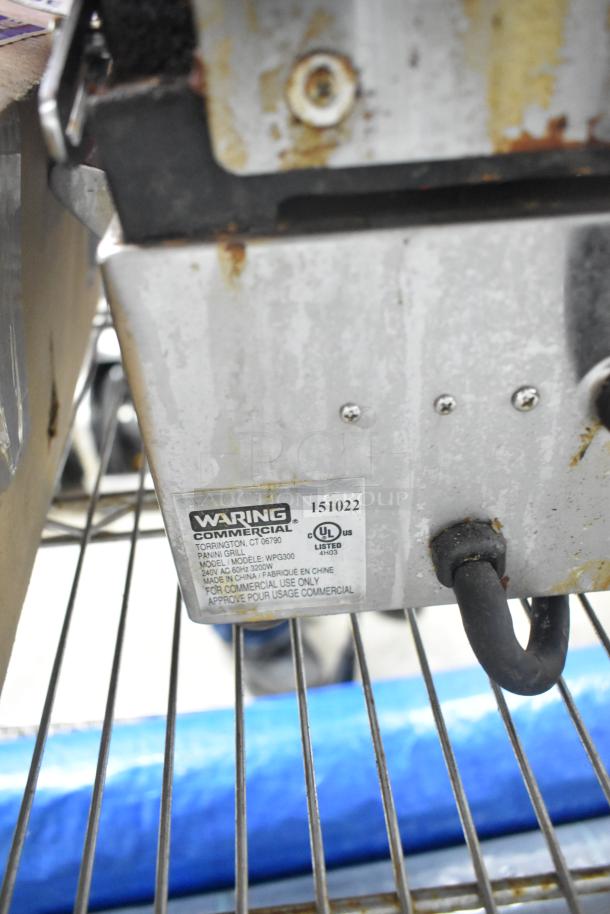 Waring WPG300 countertop double panini press, 240V, 1 Phase, commercial use, visible wear, with model label shown.