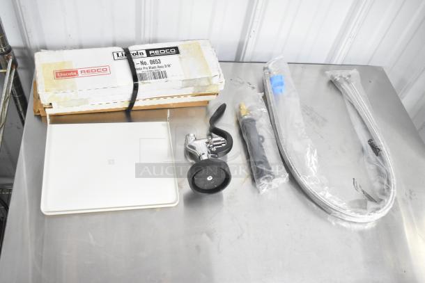 Eight assorted kitchen items including Lincoln Redco 0653 Tomato Blade Assembly, spray nozzle, and hoses, new condition.