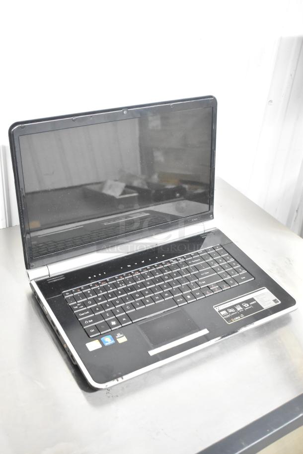 Gateway KAYF0 Laptop, black and silver, visible wear, detailed touchpad, feature stickers, and logos on keyboard area.