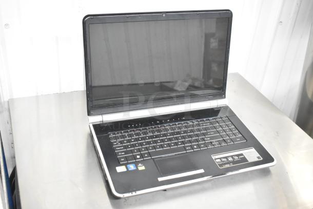 Gateway KAYF0 Laptop, 15-inch, visible wear, Intel inside and Windows sticker on palm rest, sleek black and silver design.