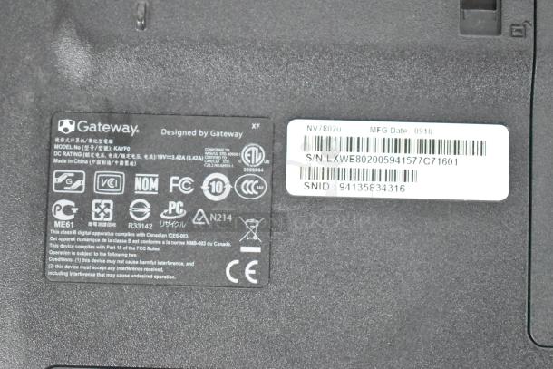 Back panel of Gateway KAYF0 laptop with model and compliance labels. Includes serial number and manufacturing date 0910.